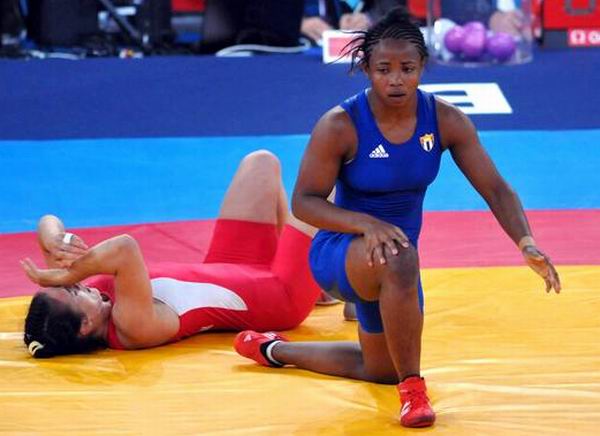 Katerina Vidiaux López (azul), perdió su segundo combate en los 63 kg. de la lucha libre femenina en los XXX Juegos Olímpicos Londres 2012, Inglaterra, el 8 de agosto de 2012. Foto: Ricardo López Hevia. Katerina Vidiaux López (azul), perdió su segundo combate en los 63 kg. de la lucha libre femenina en los XXX Juegos Olímpicos Londres 2012, Inglaterra, el 8 de agosto de 2012. Foto: Ricardo López Hevia.
