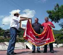 Misael Enamorado entrega bandera Plan Turquino