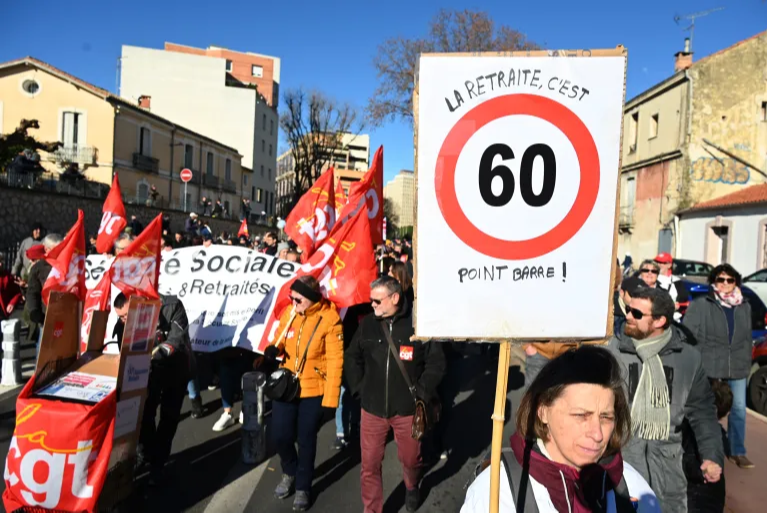 French workers, angered by Macron pension plan, strike en masse