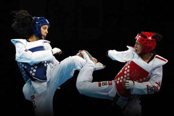 Nidia Muñoz (azul) en el taekwondo fue derrotada en la división de 57 kg por la libanesa Andrea Paoli. XXX Juegos Olímpicos Londres 2012, 9 de agosto de 2012. Foto: Hannah Johnston.